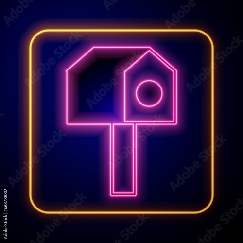 Glowing neon Bird house icon isolated on black background. Nesting box birdhouse, homemade building for birds. Vector