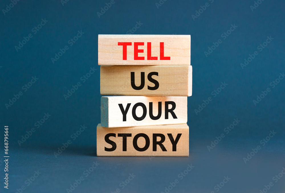 Tell us your story symbol. Concept word Tell us your story on beautiful wooden block. Beautiful grey table grey background. Business tell us your story concept. Copy space. Tell us your story symbol. Concept word Tell us your story on beautiful wooden block. Beautiful grey table grey background. Business tell us your story concept. Copy space.
