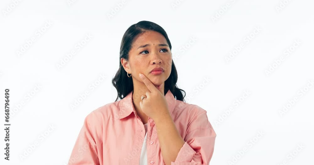 Thinking, confused and hands on face of woman in studio with choice, why or idea on white background. Questions, emoji and Asian female model with solution, doubt or problem solving and decision Thinking, confused and hands on face of woman in studio with choice, why or idea on white background. Questions, emoji and Asian female model with solution, doubt or problem solving and decision