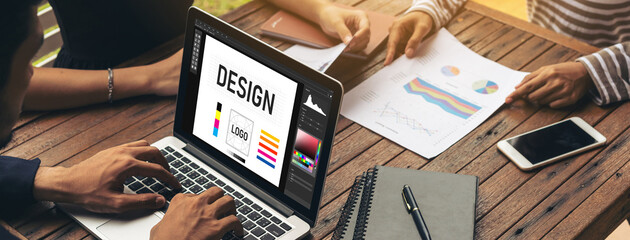 Graphic designer software for modern design of web page and commercial ads showing on the computer screen