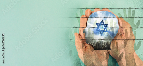 Holding face with flag of Israel, Star of David and barbed wire with hands, war between jewish and palestinians, refugees photo