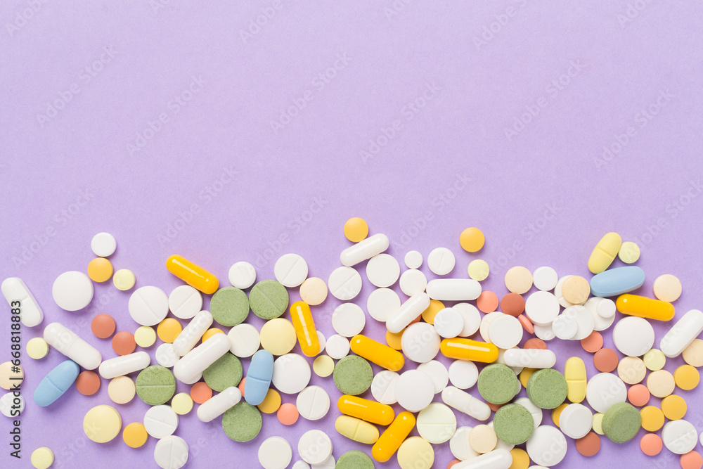 Different medical pills and capsules on color background, top view Different medical pills and capsules on color background, top view