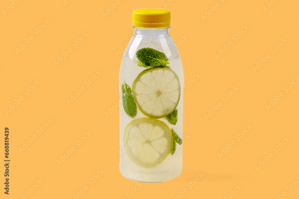 Mojito lemonade with lemon, lime, mint, mojito syrup, ice, sparkling water on yellow background for food delivery website