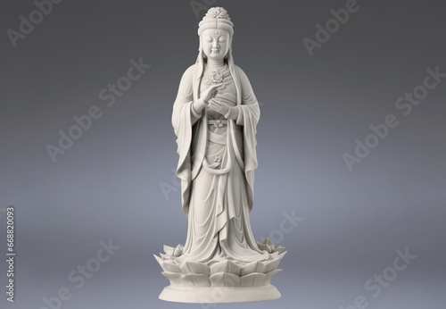 The marble sculpture depicts the Goddess of Mercy in an elegant and peaceful manner, standing on a lotus stand. on a white background