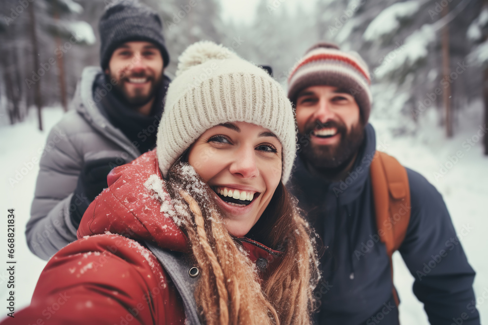 Happy friends having fun taking and selfie together outdoors in winter In forest Happy friends having fun taking and selfie together outdoors in winter In forest