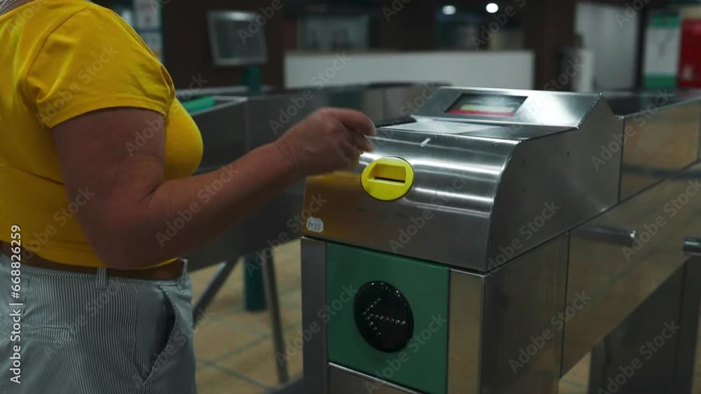 Unrecognizable woman hand scanning train ticket to subway entrance gate. Transportation concept. High quality FullHD footage Unrecognizable woman hand scanning train ticket to subway entrance gate. Transportation concept. High quality FullHD footage