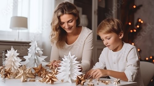 happy mother and son doing crafts for christmas.