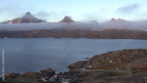 aerial view of the mountains and arctic ocean in Greenland under the fog. photo