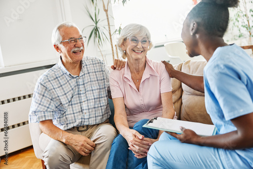 nurse doctor senior couple care caregiver help assistence retirement home nursing elderly man woman insurance black