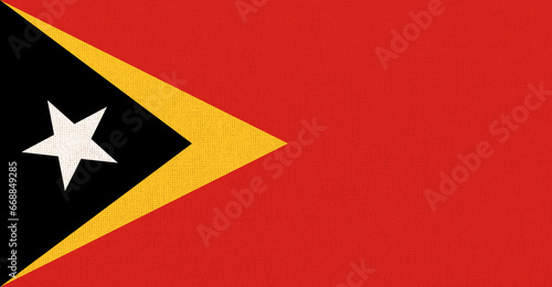 Flag of East Timor. East Timor flag on fabric surface. East Timor national flag