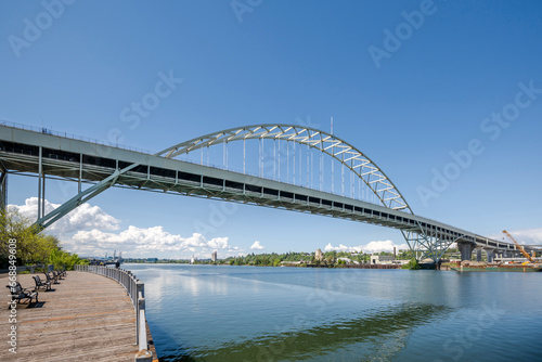 Large arched truss two-story transport Fremont Bridge over the full-flowing Willamette River in Portland Oregon © vit