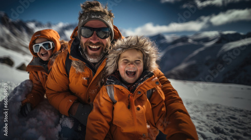 Father with kids having fun in winter mountains. Vacation and travel concept.