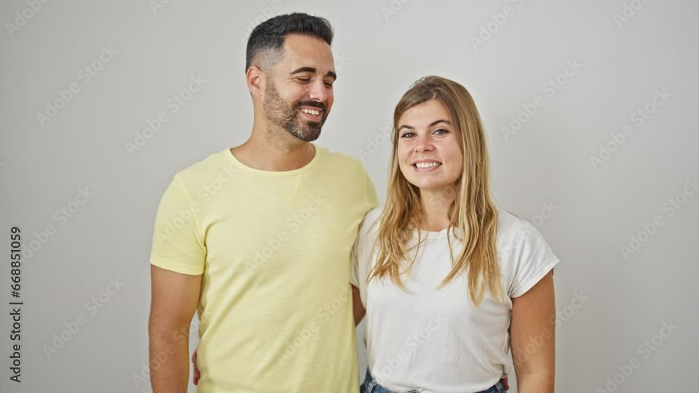 Man and woman couple smiling confident hugging each other kissing over isolated white background Man and woman couple smiling confident hugging each other kissing over isolated white background