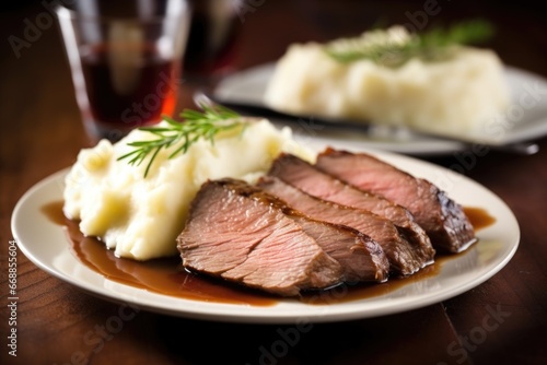 brisket slices served with mashed potatoes