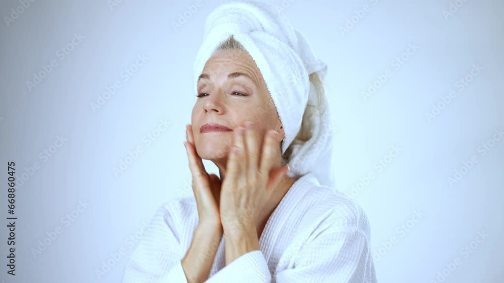 Portrait of happy 50s, 60s mature woman touching face skin pampering . Old healthy dry skin care beauty concept, cosmetics and anti age. Portrait of happy 50s, 60s mature woman touching face skin pampering . Old healthy dry skin care beauty concept, cosmetics and anti age.
