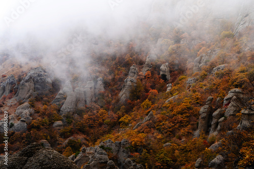 Beautiful autumn landscape of rocks in the fog