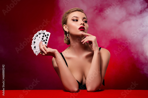 Photo of attractive seductive woman wear dress playing black jack look empty space isolated red ruby color background photo