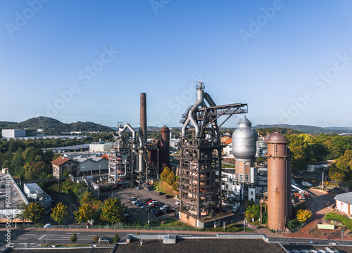 Obraz na płótnie Autumn cityscape of Neunkirchen, Saarland, Germany. Aerial view of Altes Hüttenareal - Neunkirchen Ironworks (German: Neunkircher Eisenwerk) w salonie