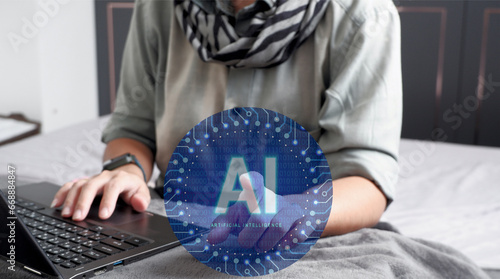 Fényképezés Mujer trabajando en su laptop tocando el símbolo de Inteligencia Artificial representando que la ha incorporado a sus negocios