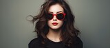 Young brunette posing in oversized sunglasses