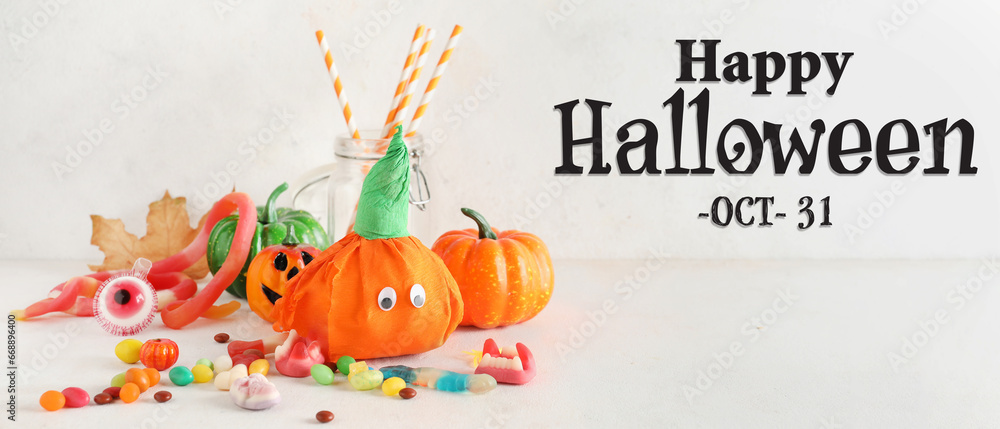 Halloween banner with pumpkins and tasty candies