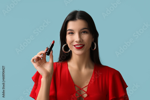 Smiling young woman in red ...