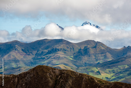 Ilinizas south peak with snow and agriculture fields, Andes mountains, Quito region, Ecuador.