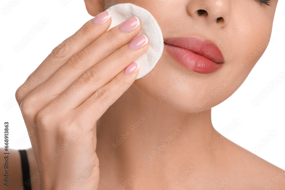 Beautiful woman removing makeup with cotton pad on white background, closeup Beautiful woman removing makeup with cotton pad on white background, closeup
