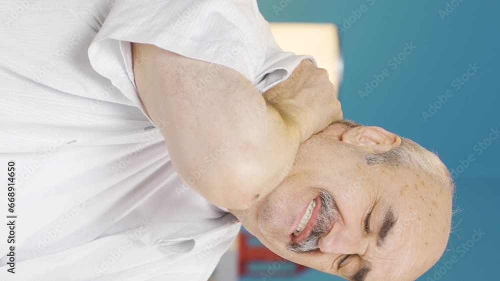 Vertical video of Sick old man suffering from neck pain. Vertical video of Sick old man suffering from neck pain.