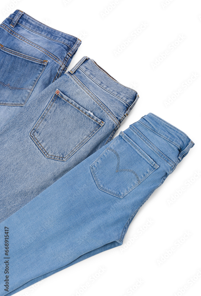 Different stylish jeans isolated on white, above view Different stylish jeans isolated on white, above view