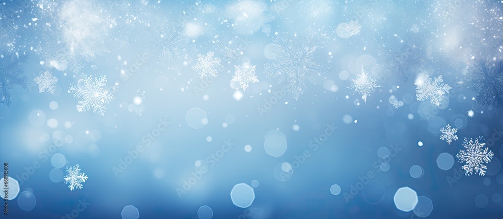 Abstract light background with a snowflake on a blue background and blurred white bokeh