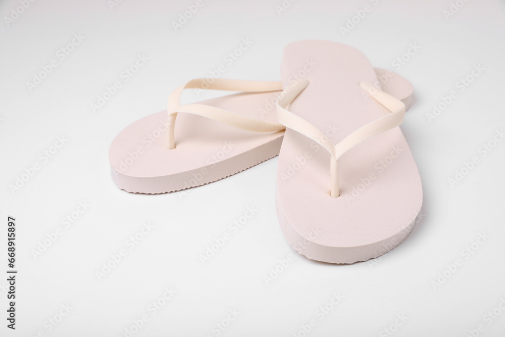 Pair of stylish flip flops on white background Pair of stylish flip flops on white background