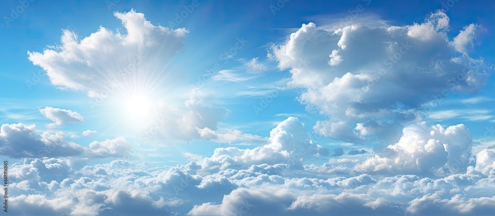 Blue sky with panoramic clouds and sunlight Blue sky with panoramic clouds and sunlight