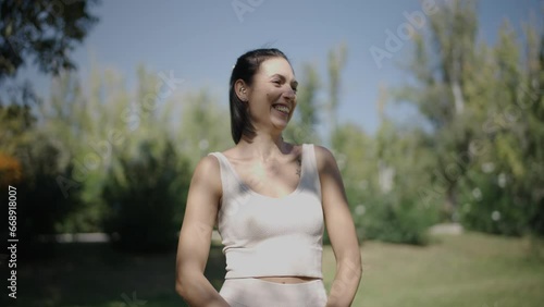 young Spanish woman exercising her body with elastic bands in a park in her city