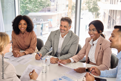 Tableau sur toile Happy diverse executive business people group working together at meeting in boardroom office