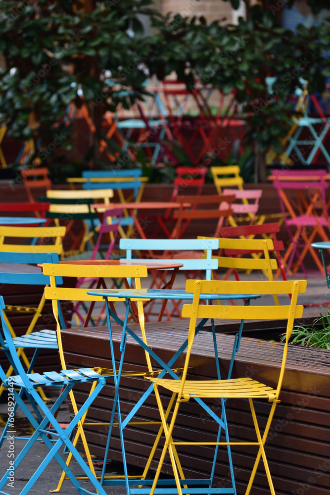 Colorful outdoor tables and chairs at cafe