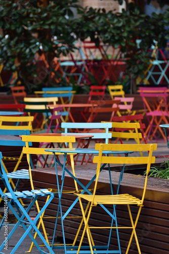 Colorful outdoor tables and chairs at cafe