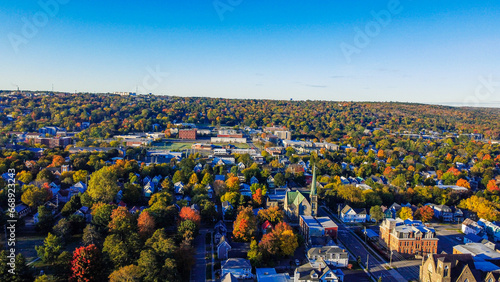 aerial view of a forested town during autumn photo