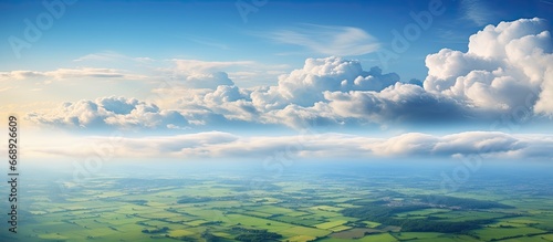 Aerial perspective of the land fields and clouds