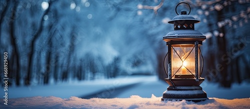 Old style lantern in a cold park photo