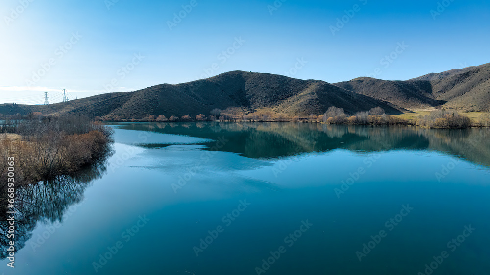 Views of the tranquil Wairepo arm lagoon which is part of Lake Ruataniwha near the village of Twizel at dawn
