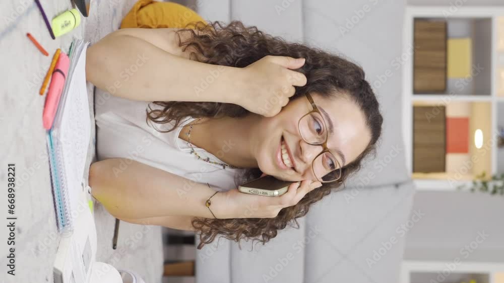 Vertical video of Female student chatting with her boyfriend on the phone. Vertical video of Female student chatting with her boyfriend on the phone.