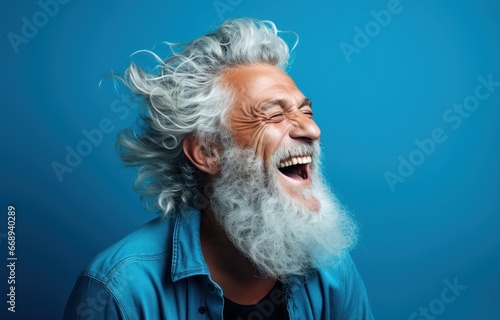 Animated elderly man with white flowing hair and a long beard, laughing heartily against a turquoise backdrop. Perfect for projects emphasizing joy, age, and liveliness.