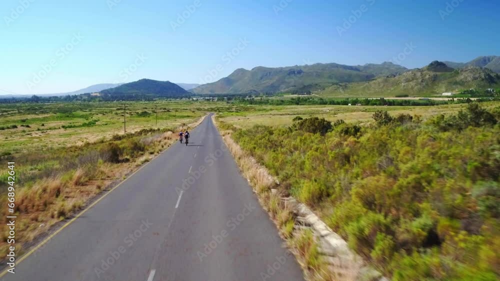 Nature, bicycle and people cycling in countryside for exercise, fitness training and workout outdoors. Travel, sports and aerial of cyclists friends for adventure, freedom or journey on mountain road Nature, bicycle and people cycling in countryside for exercise, fitness training and workout outdoors. Travel, sports and aerial of cyclists friends for adventure, freedom or journey on mountain road