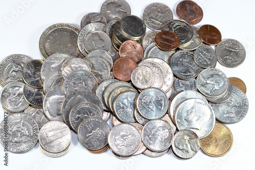 Pile of American coins of different times and values, 1 cents, dimes, quarters, half dollars, and dollars, vintage retro old United States of America coins, exchange rate, economy concept, USA coins photo