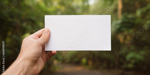 hand holding blank card