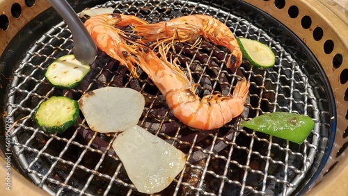 barbecue plate of shramps and Dinner together design for family time and joyful time