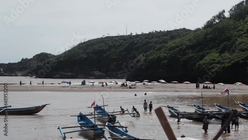 The video sof  Gunungkidul Beach name Baron in Indonesia, renowned for its white sandy shores, clear waters, limestone cliffs, and serene atmosphere, making it a perfect for nature lovers