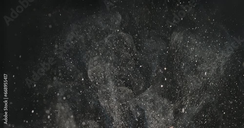 Splashes and smoke from cooking on black background. Cinematic advertising video. Cooking in kitchen. Suitable for videos about any food during frying. Professional quality video