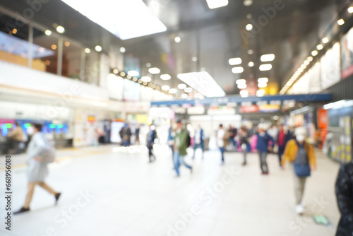 Blurred abstract background of people on subway train platform, travel concept photo